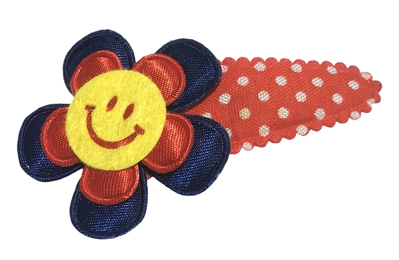 Leuk rood gestippeld peuter kleuter haarspeldje. 
Met een donkerblauw bloemetje, rood bloemetje en een vrolijke gele smiley. 