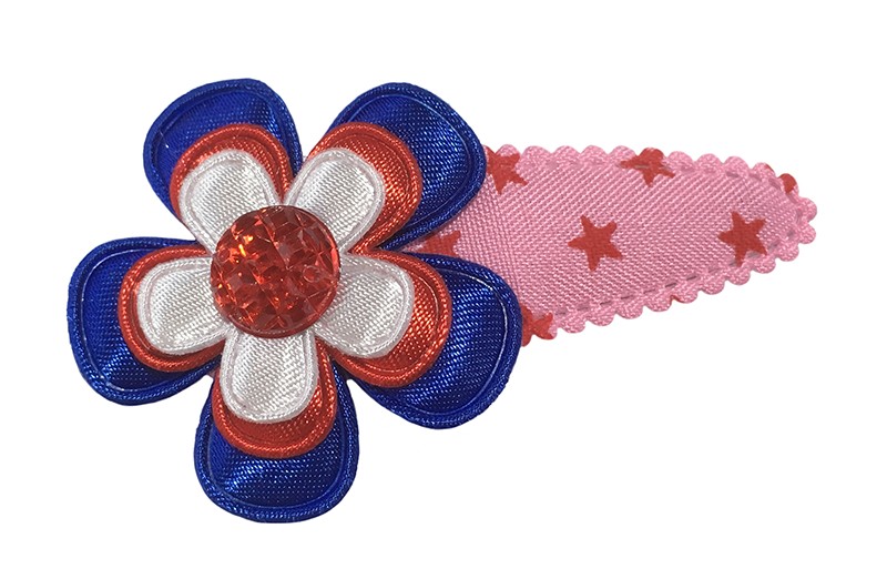Vrolijk roze peuter kleuter haarspeldje met sterretjes. 
Met een blauw bloemetje, rood bloemetje en een wit bloemetje. Afgewerkt met een rood pareltje. 