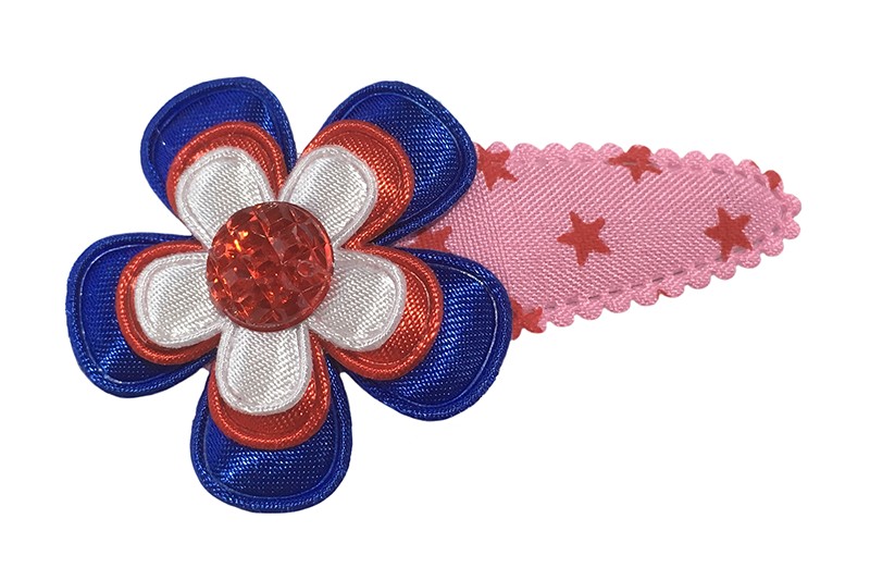 Vrolijk roze peuter kleuter haarspeldje met sterretjes. 
Met een blauw bloemetje, rood bloemetje en een wit bloemetje. Afgewerkt met een rood pareltje. 