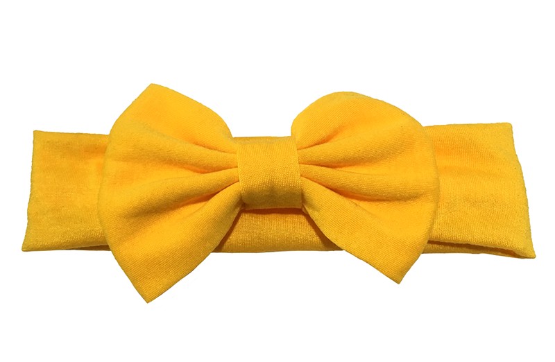 Vrolijke warm gele baby peuter meisjes haarband van rekbare stof met een grote stoffen strik. 