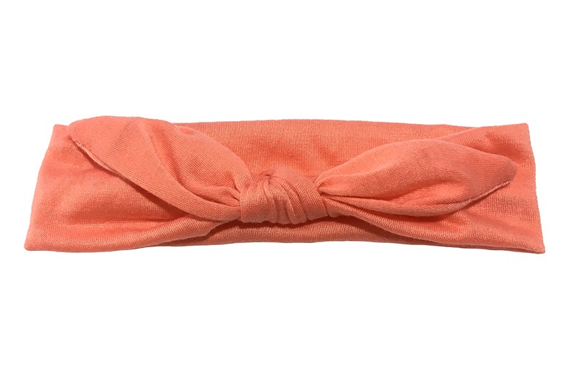 Lief effen zacht oranje/koraal roze baby peuter haarbandje van zachte rekbare stof. In een leuk modelletje geknoopt. 
Het haarbandje is ongeveer 5 centimeter breed. 